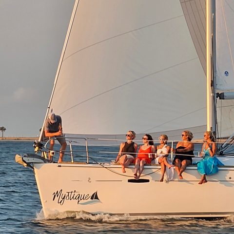 a group of people on a boat in the water