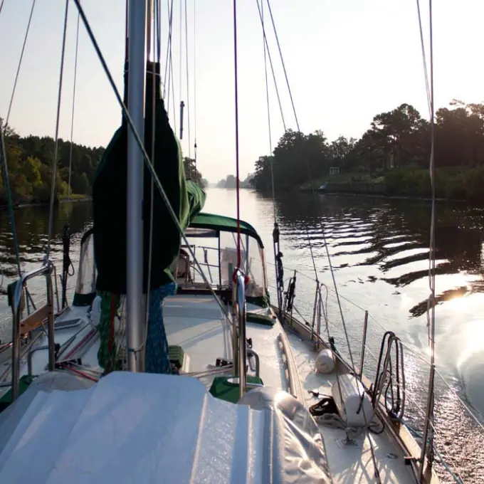 a boat is docked next to a body of water