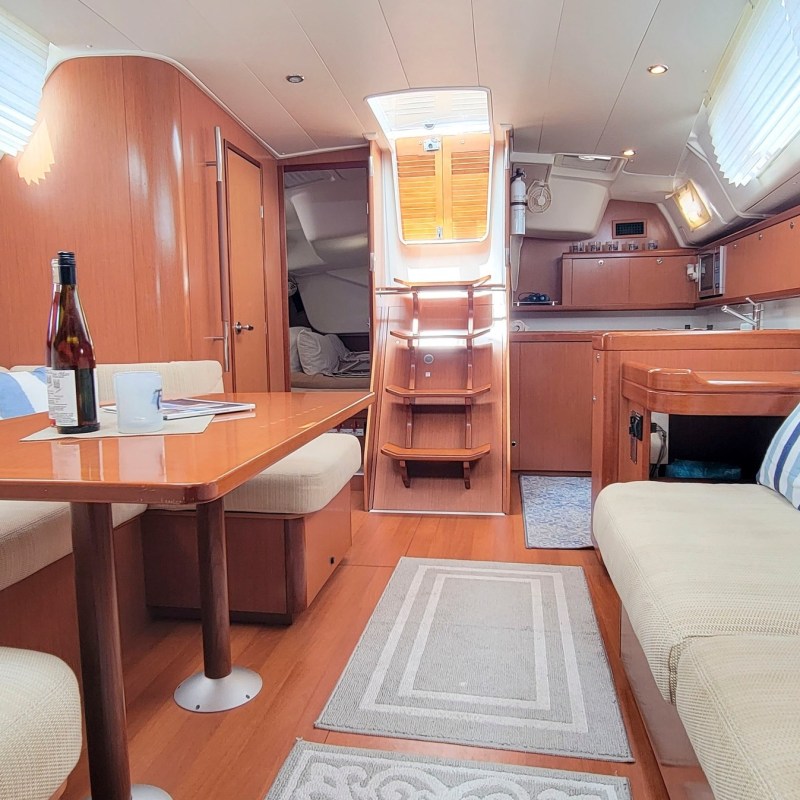 a bedroom with a bed and desk in a room