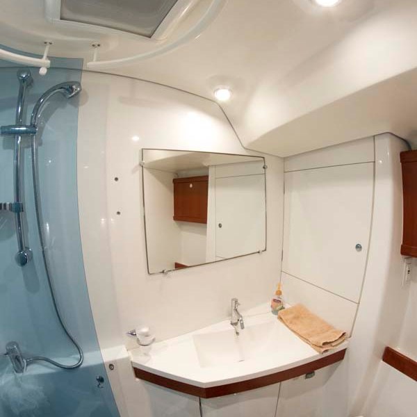 a room with a sink and a mirror