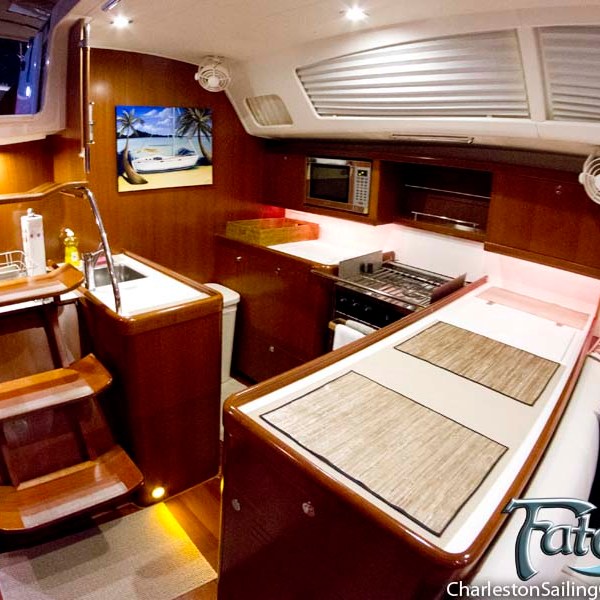 a kitchen with a stove top oven sitting inside of a wooden table
