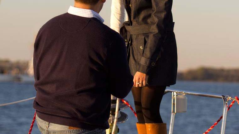 a person standing next to a boat