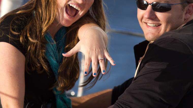 a man and a woman smiling for the camera