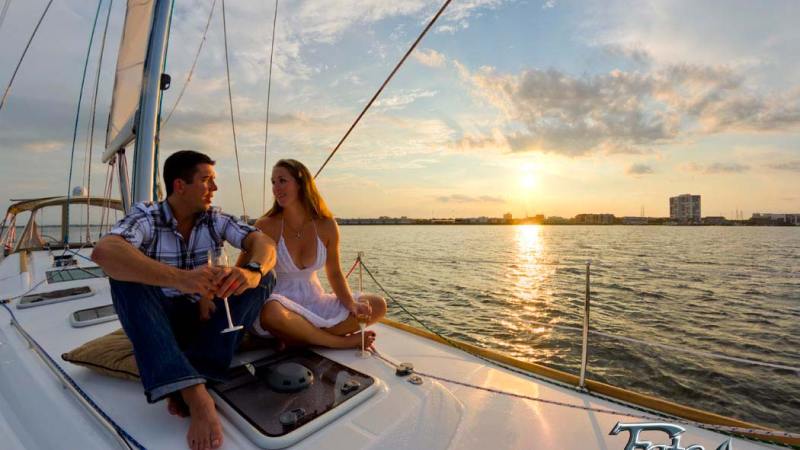 a man sitting in a boat on a body of water