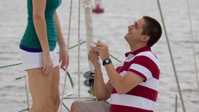 a little boy that is standing in the water