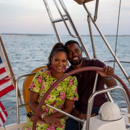 a couple of people on a boat in a body of water