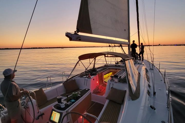 a group of people in a boat on a body of water