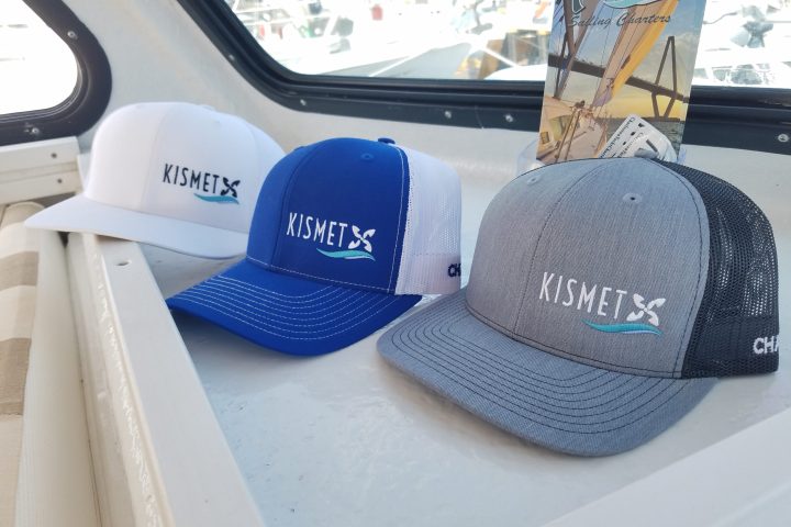 a group of stuffed animals sitting on top of a car window