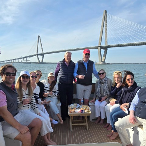 Jonathan Freeman et al. on a bridge over a body of water
