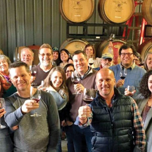 Brian Haner et al. holding wine glasses