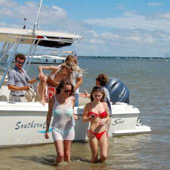 a group of people in a boat on a body of water