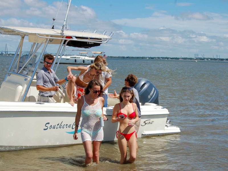 a group of people in a boat on a body of water