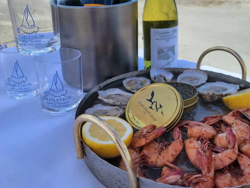 a plate of food and a bottle of water on a table