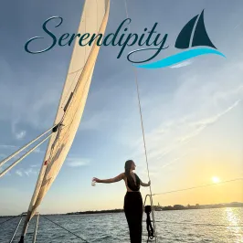 Woman on a sailboat at sunset under the word 'Serendipity' with logo.